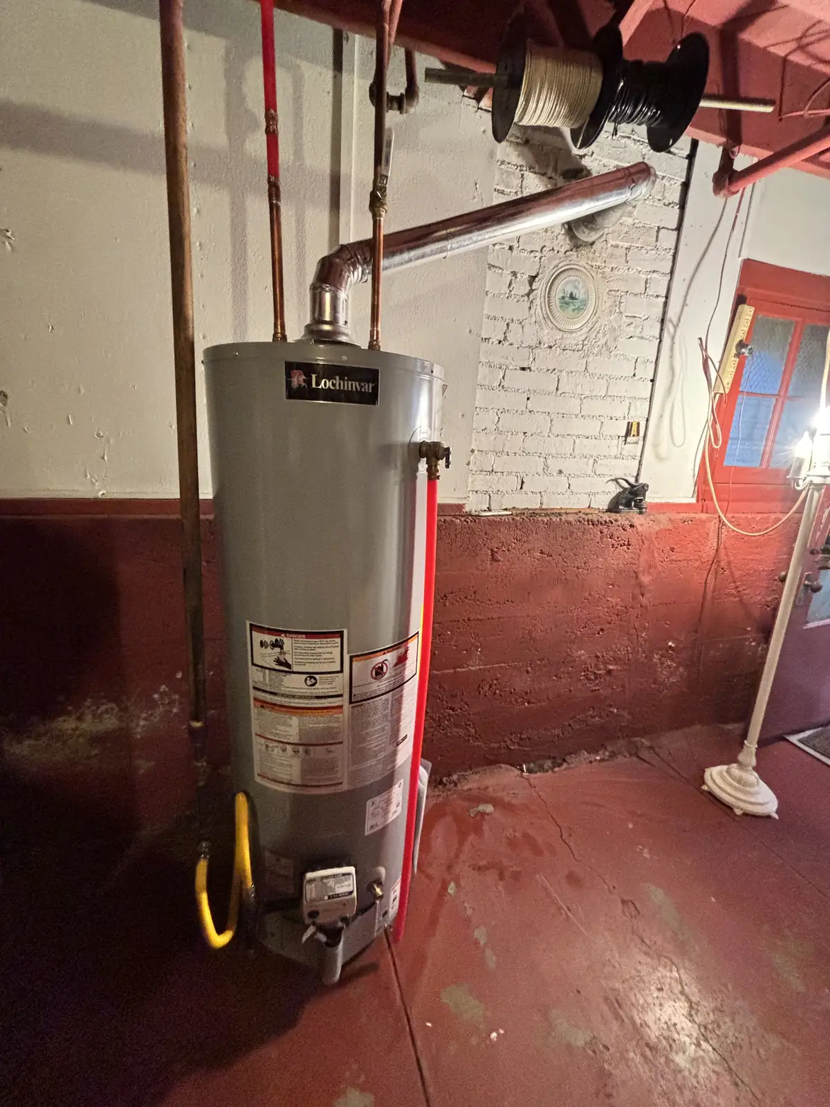 New gas water heater with new venting in an older basement